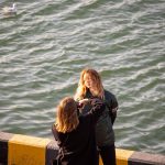 Девушка фотографирует подругу в порту города Одесса 3