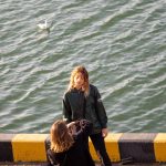 Девушка фотографирует подругу в порту города Одесса 5