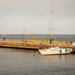 Маленькое парусное судно с названием Шериф в порту города Одесса 1