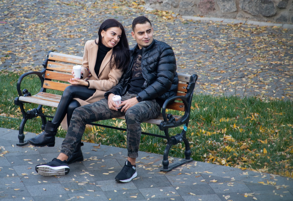 The girl and the guy on the bench are looking at something interesting - Ukraine, Odessa, 11,06,2020