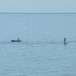 People on surfboards with paddles in the sea - Ukraine, Odessa, 11,06,2020