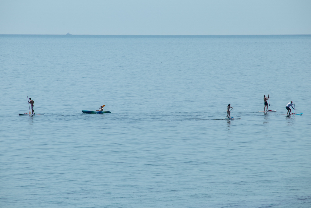 People on surfboards with paddles in the sea - Ukraine, Odessa, 11,06,2020