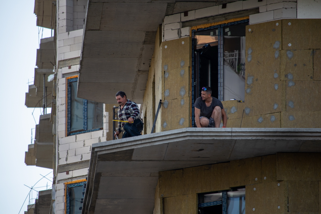 Installers without insurance perform work on the facade of a high-rise building - Ukraine, Odessa, 11,06,2020