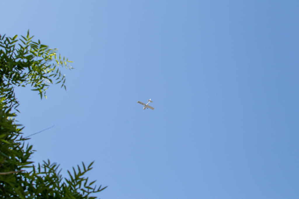Single-engine plane flies over the beach - Ukraine, Odessa, 11,06,2020
