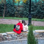 Fellow teen kisses girl on bench - Ukraine, Odessa, 11,06,2020