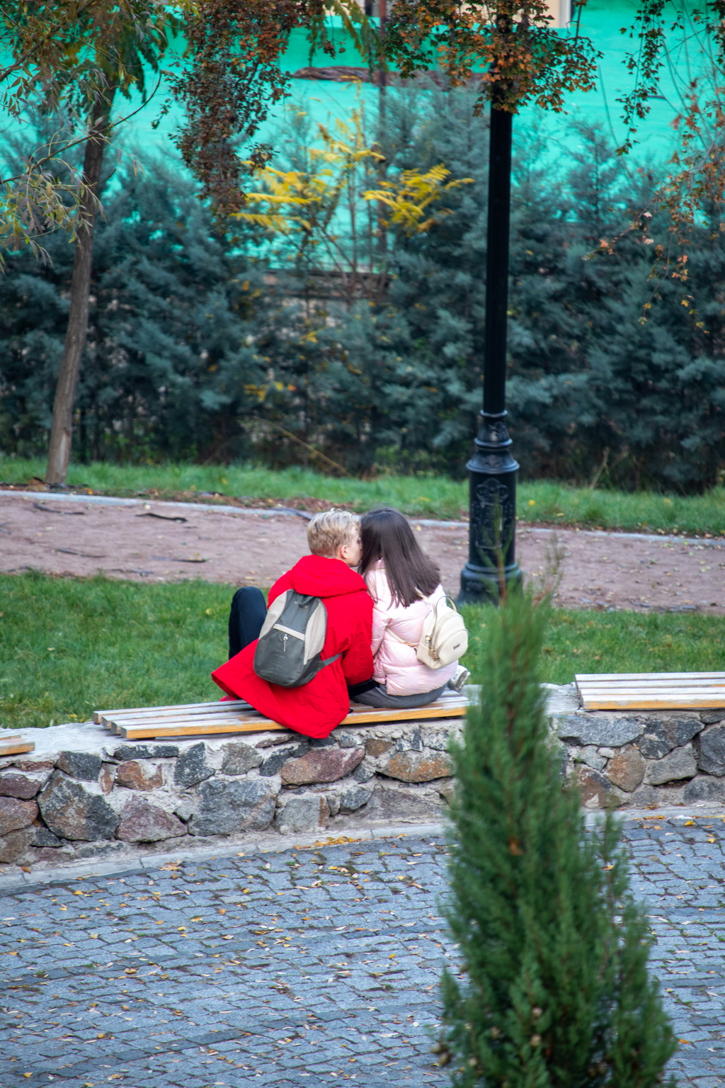 Fellow teen kisses girl on bench - Ukraine, Odessa, 11,06,2020