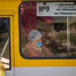 Pensioner rides in trolley bus with medical mask on her face - Ukraine, Odessa, 11,06,2020