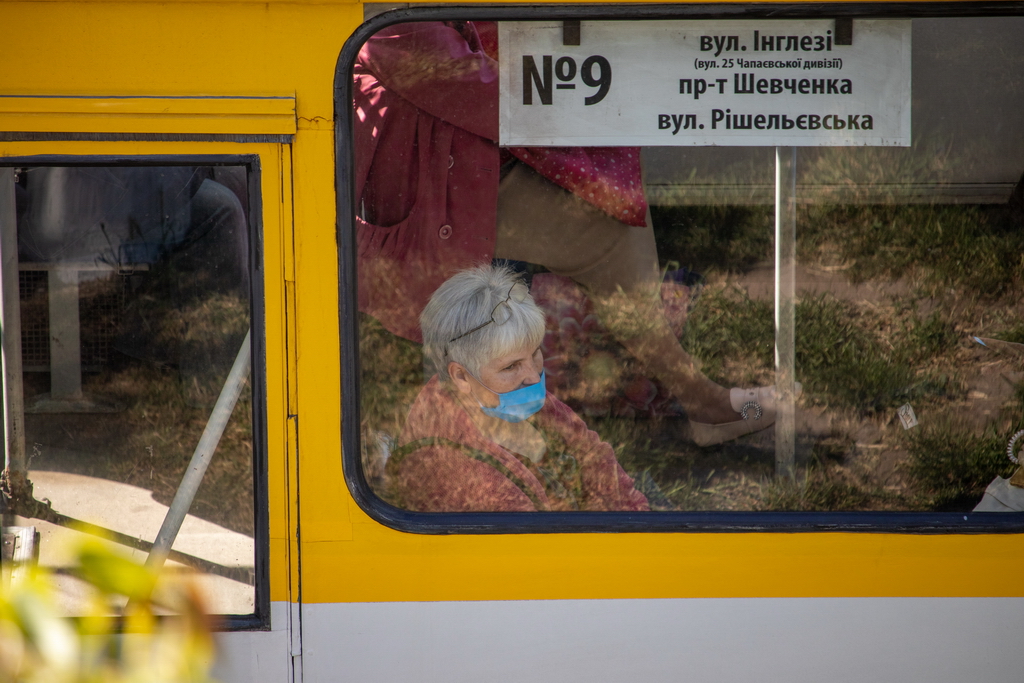 Pensioner rides in trolley bus with medical mask on her face - Ukraine, Odessa, 11,06,2020